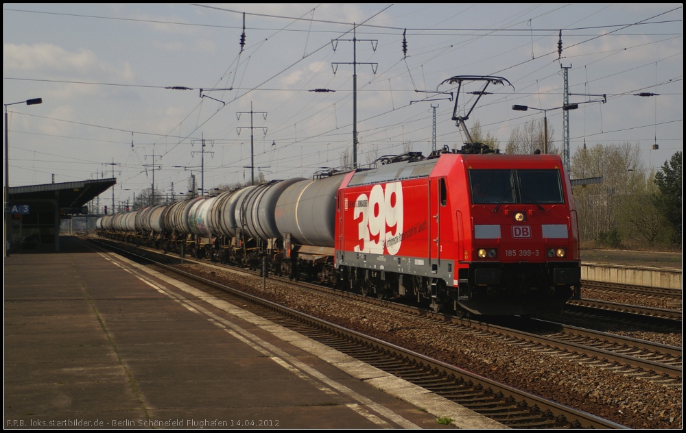 DB Schenker 185 399-3  DB Schenker und Bombardier  mit Kesselwagen (gesehen Berlin Sch�nefeld Flughafen 14.04.2012)