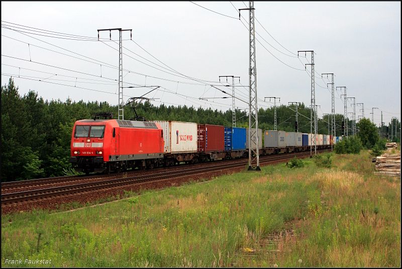 DB 145 034-5 mit einem Containerzug. Die Lok ist mit Regio-Paket ausger�stet (DB Schenker Rail Deutschland AG, gesichtet Berlin Wuhlheide 29.06.2009)